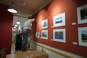 Hanging the images in Café Red